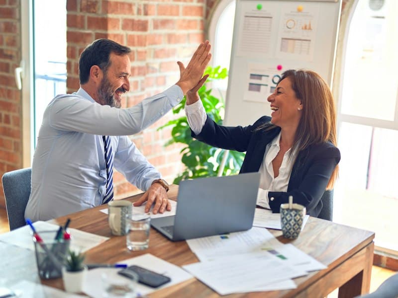 Corporate team collaborating in modern office